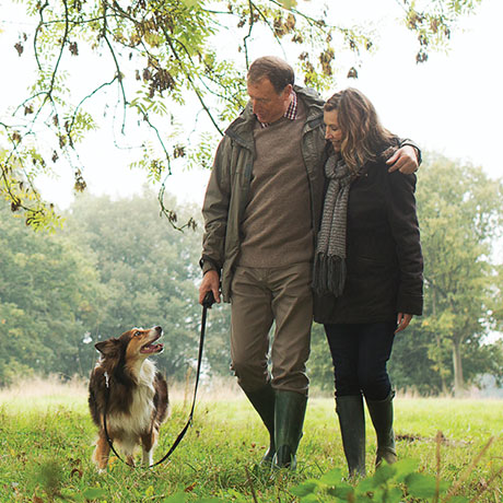 Couple walking dog