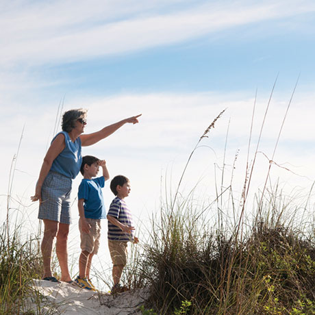 grandmother with grandchilden at the beach